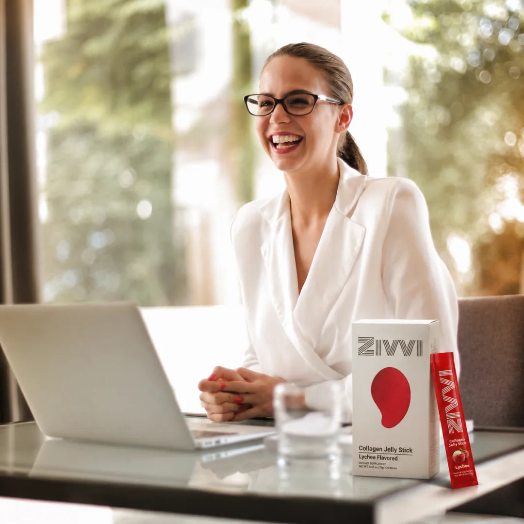 A smiling woman working beside a Zivvi box and jelly stick