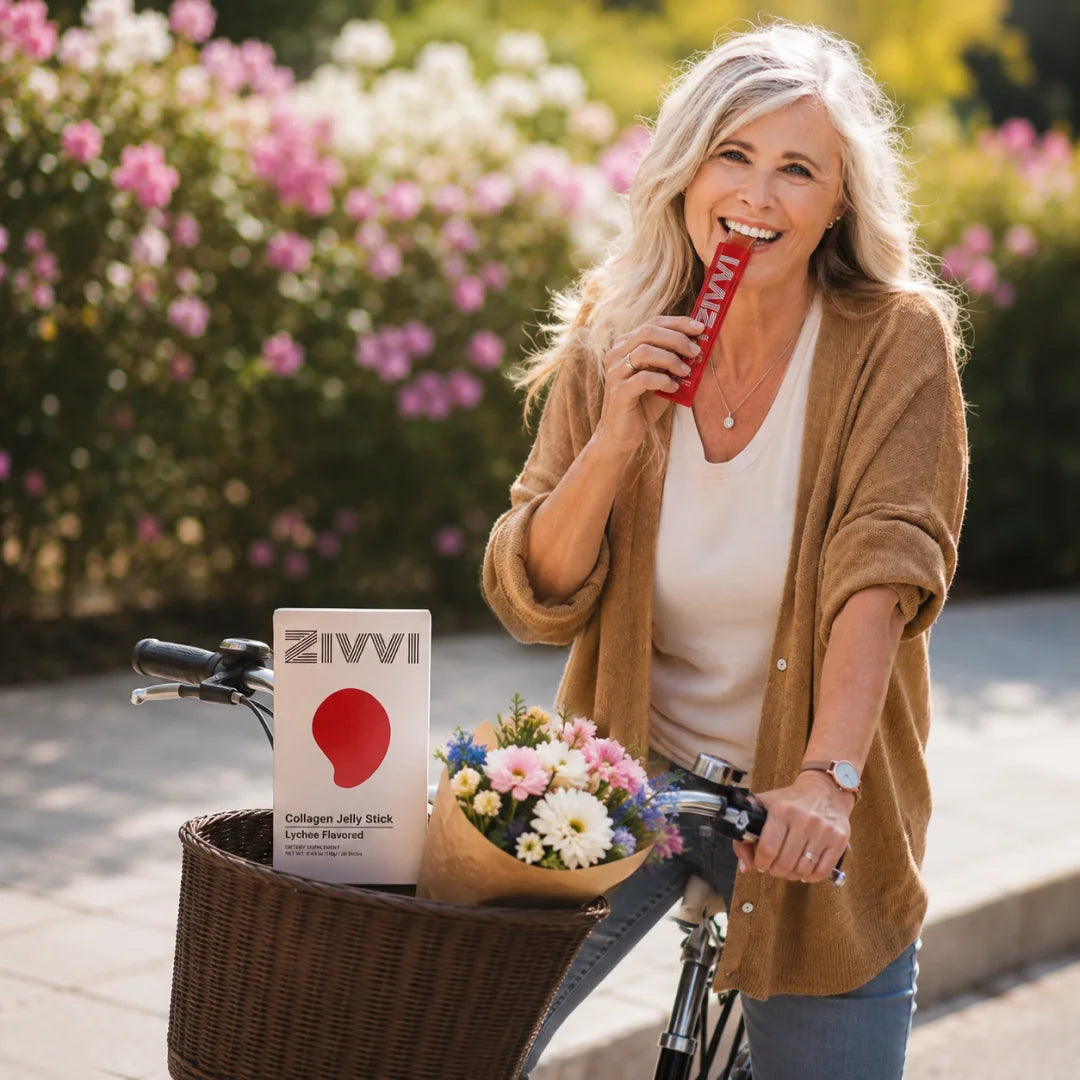 An active woman enjoying a Zivvi jelly stick beside her bicycle